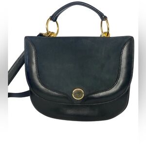 Vintage women’s leather bag with gold hardware